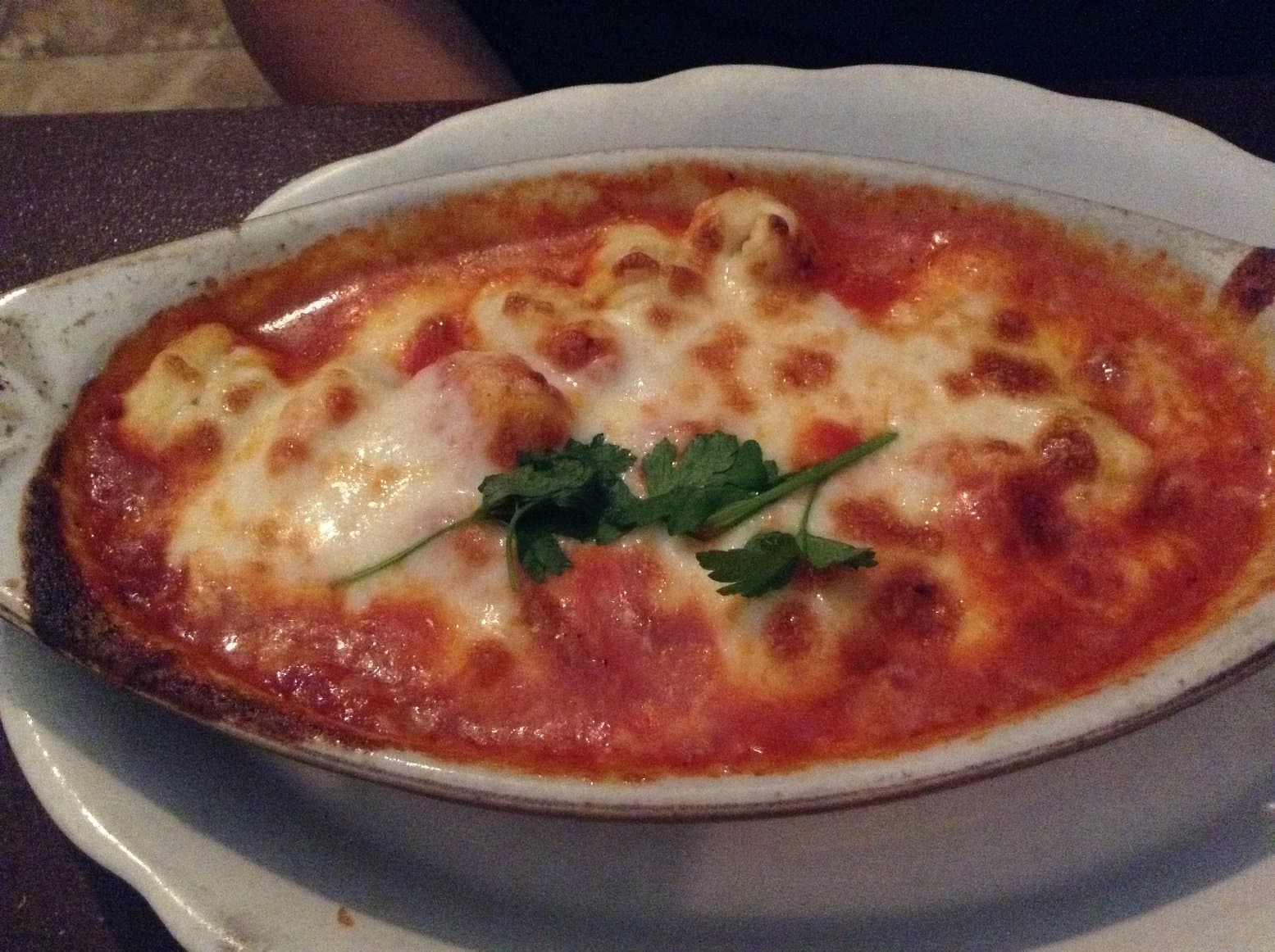 Baked gnocchi with a golden browned cheese crust at Valenti's Ristorante